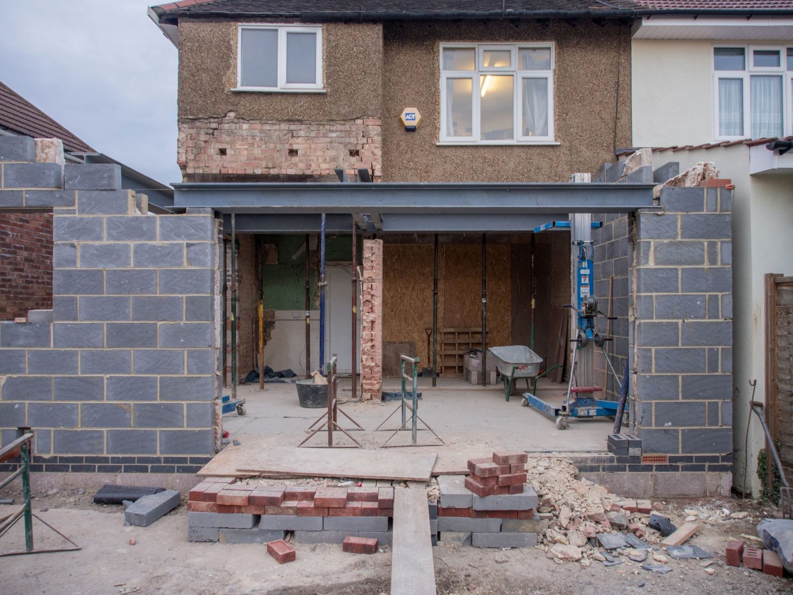 House extension in progress with a steel beam across the new opening